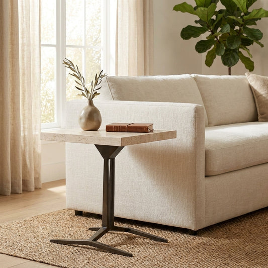 Minimalist living room with sofa, side table, and plant.