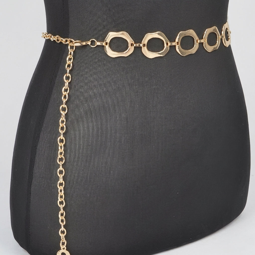 Gold chain belt with circular links on a black mannequin.
