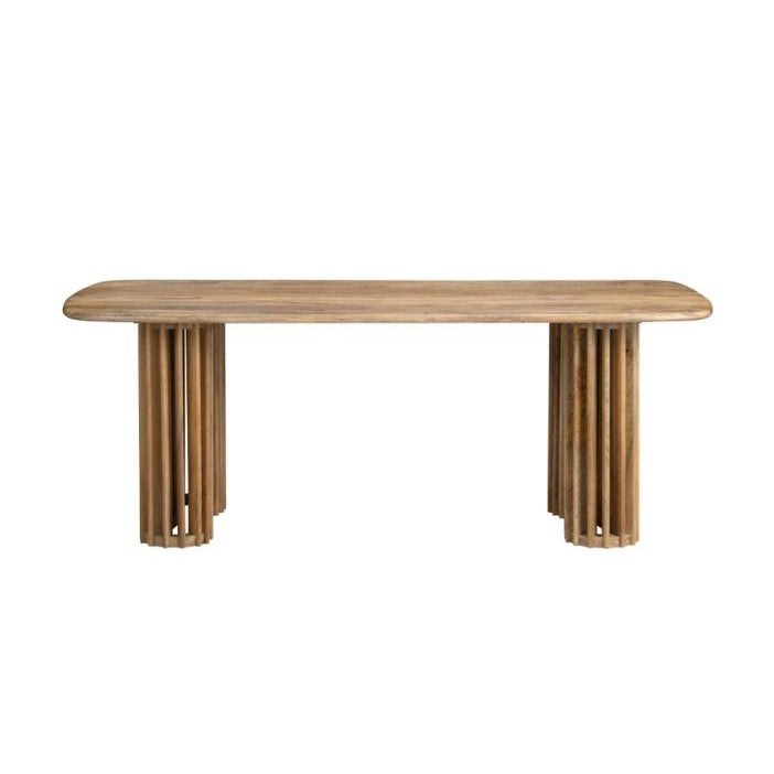 Wooden table with rounded edges and cylindrical legs.