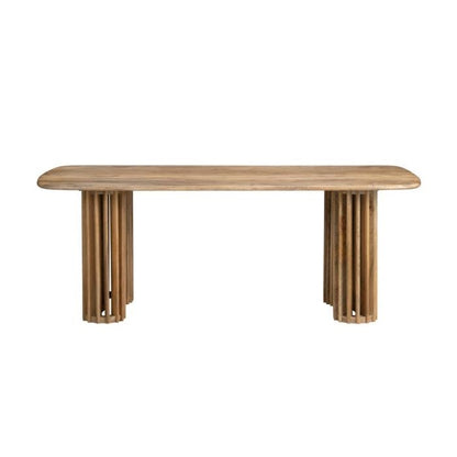 Wooden table with rounded edges and cylindrical legs.