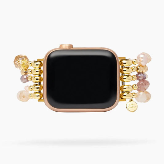 Smartwatch with a beaded band and decorative gold accents.
