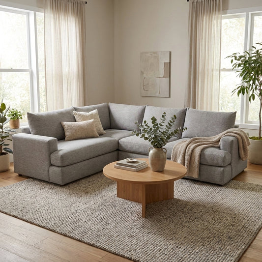 Gray sectional sofa with chaise, modern and spacious.
