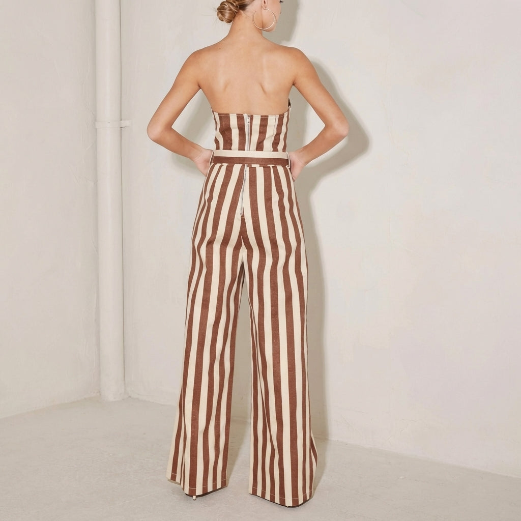 Woman in striped strapless jumpsuit, brown and white.