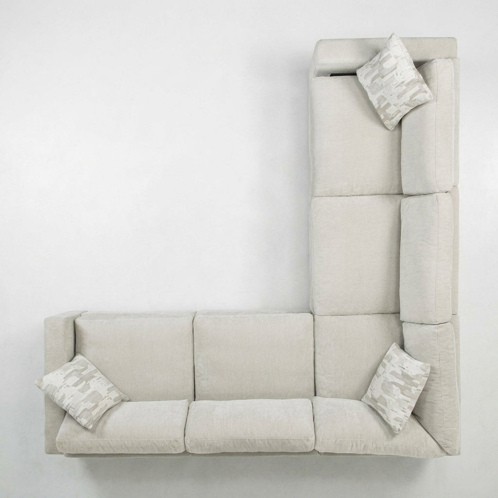 L-shaped beige sofa with three cushions.