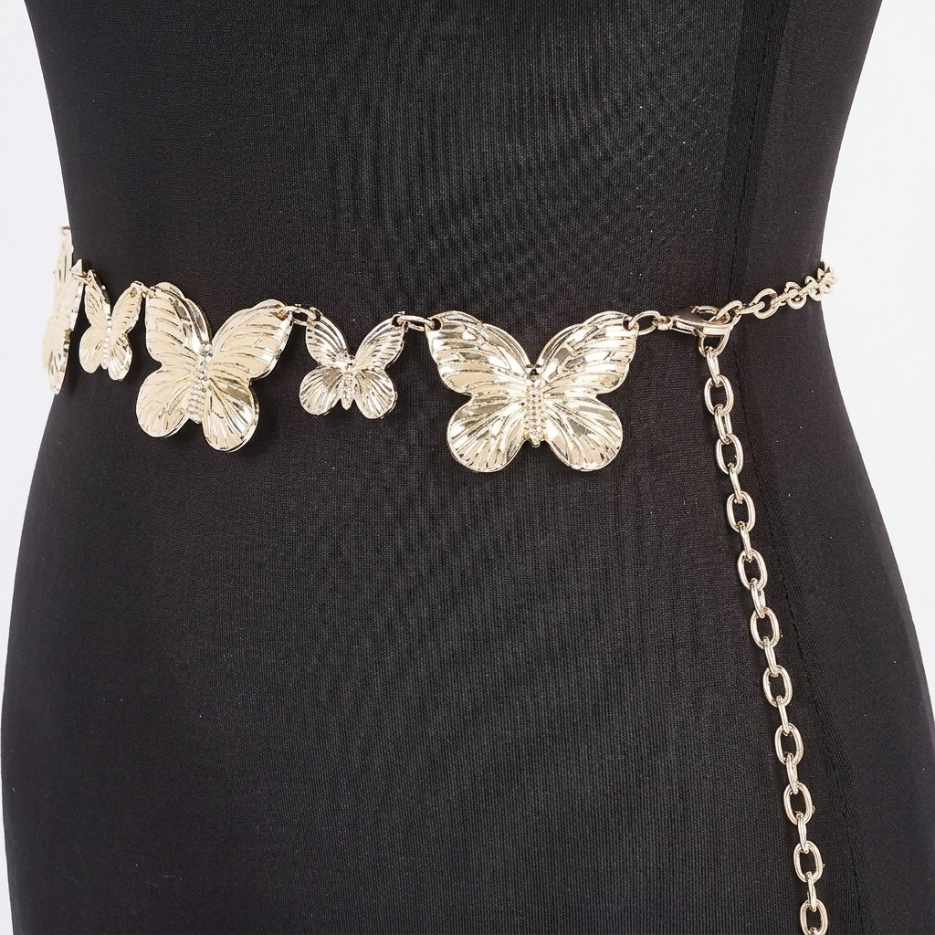 Butterfly belt on black dress mannequin.