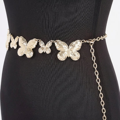 Butterfly belt on black dress mannequin.