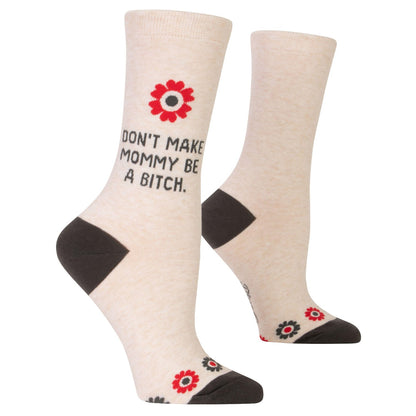 Light beige socks with playful text and floral design.
