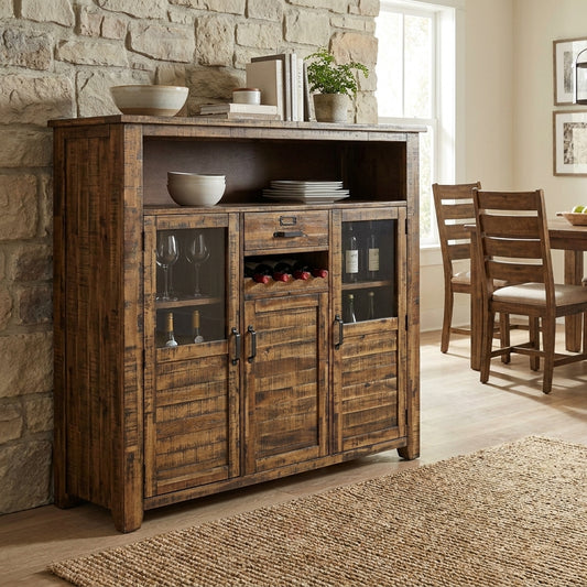 Rustic wooden sideboard with wine and glass storage near dining table.