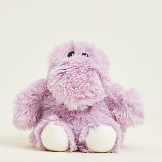 Fluffy purple stuffed animal with black eyes and white feet.