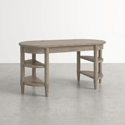 Oval wooden desk with side shelves on concrete floor.