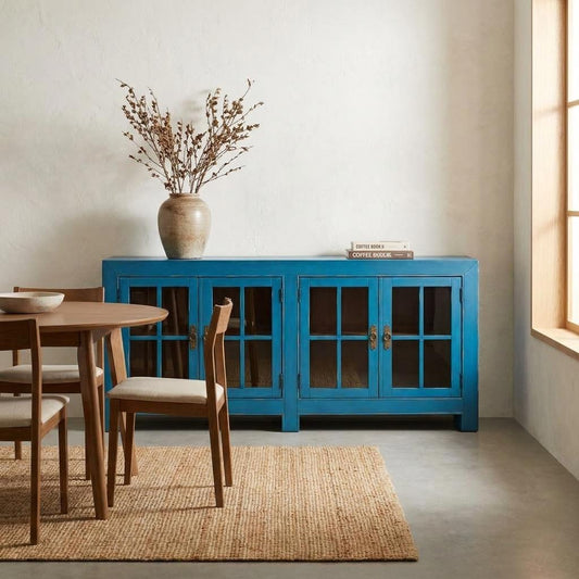 Blue wooden cabinet with glass-paneled doors.