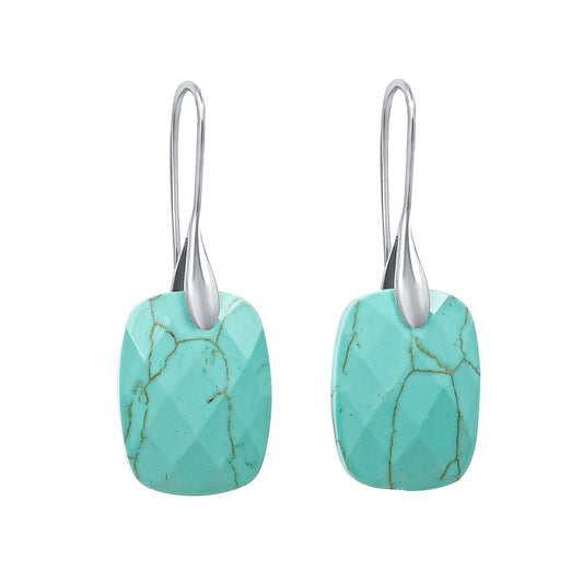Turquoise stone earrings with silver hooks.