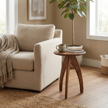 Wooden stool with a round top and three curved legs.