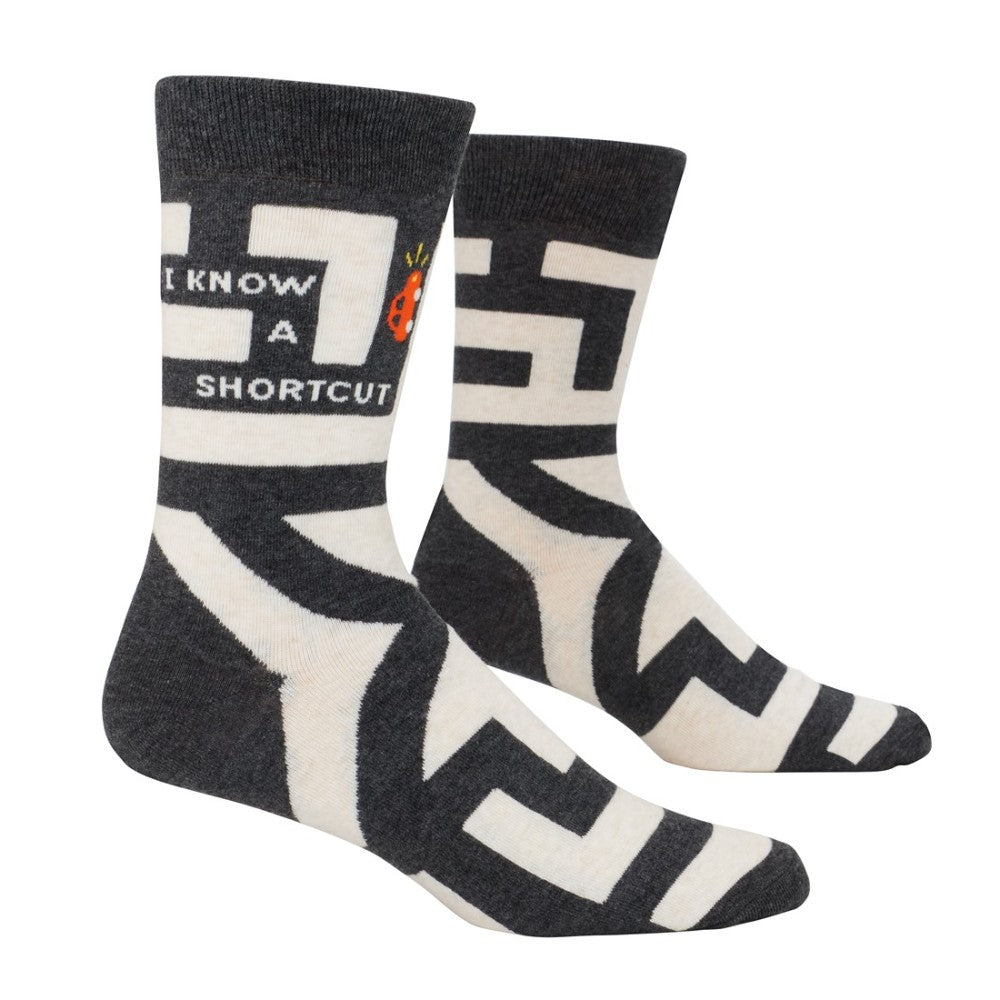 Socks with "I KNOW A SHORTCUT" graphic in black and white.