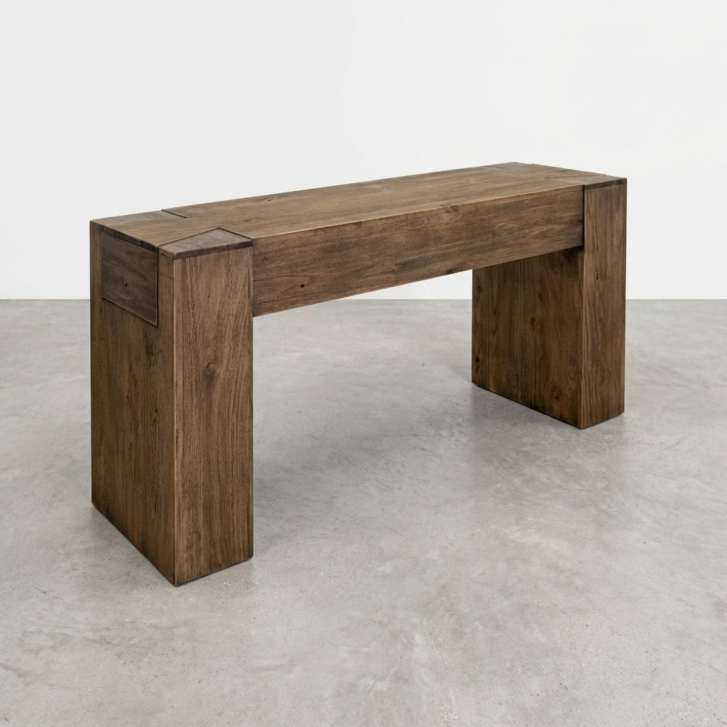Wooden bench with a modern, minimalist design on a concrete floor.