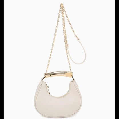 Beige handbag with gold chain strap and metallic handle.