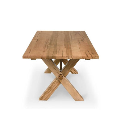 Wooden table with a trestle base and simple design.