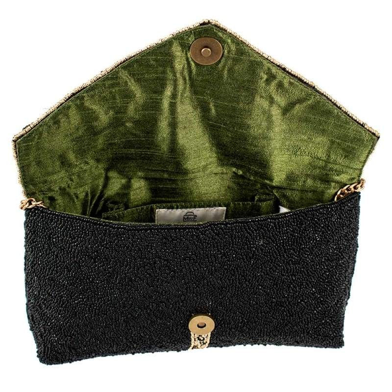 Open black beaded clutch with green satin interior.