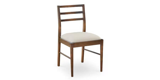 Wooden chair with a ladder back and a cushioned seat.