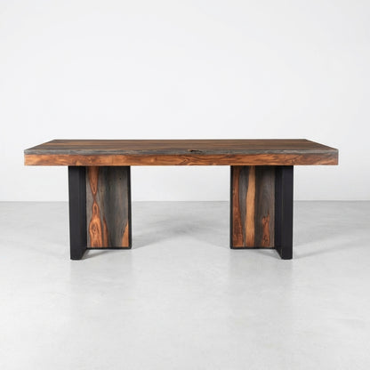 Modern wooden table with dark legs and a polished top.
