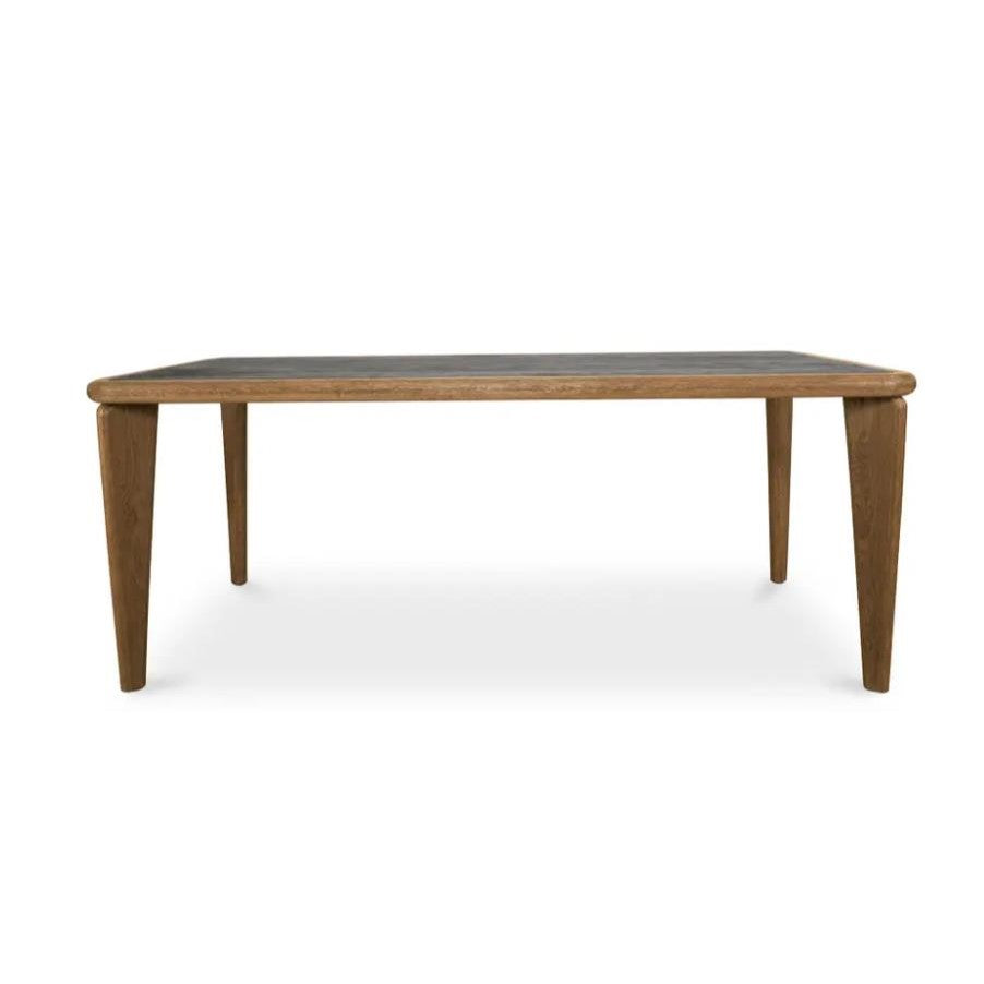 Rectangular wooden table with sleek legs.