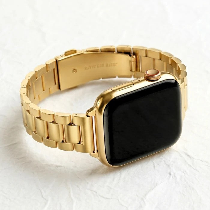 Gold smart watch with a black screen and linked bracelet.