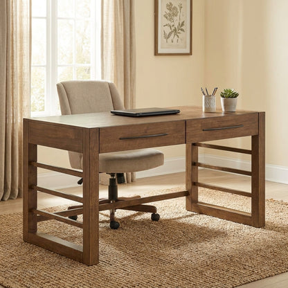 Wooden desk with laptop, chair, and decor in a bright, cozy room.