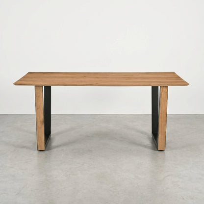 Wooden table with black metal legs on a white background.