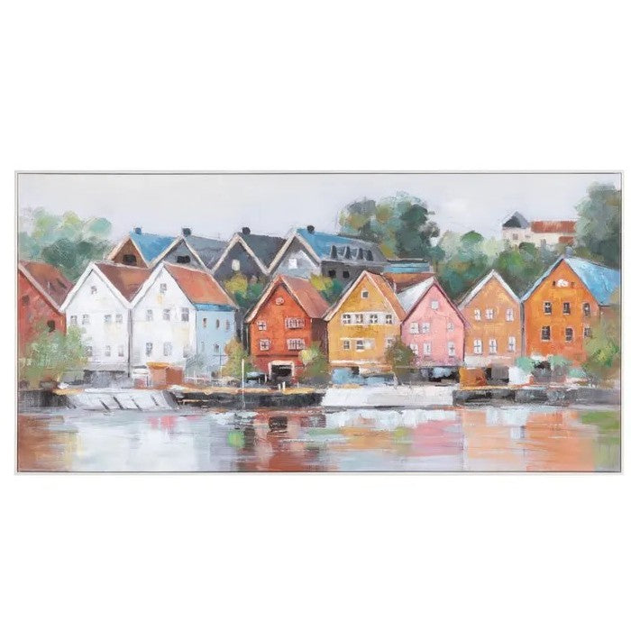 Colorful houses reflected in a tranquil river setting.