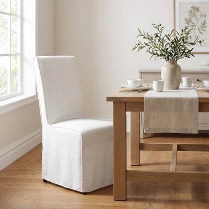 White chair with a fitted slipcover.