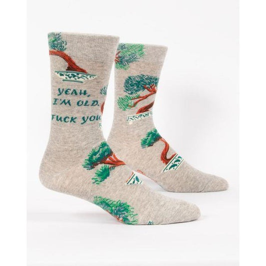 Gray socks with bonsai tree art and a humorous, bold text.
