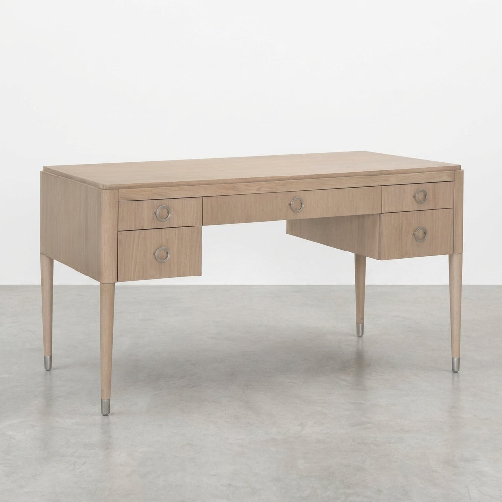 Wooden desk with four drawers, metal handles, and tapered legs.