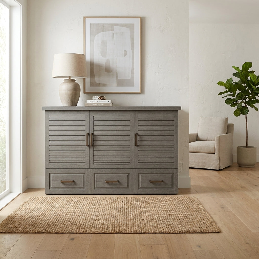 Minimalist room with a wooden cabinet, lamp, and potted plant.