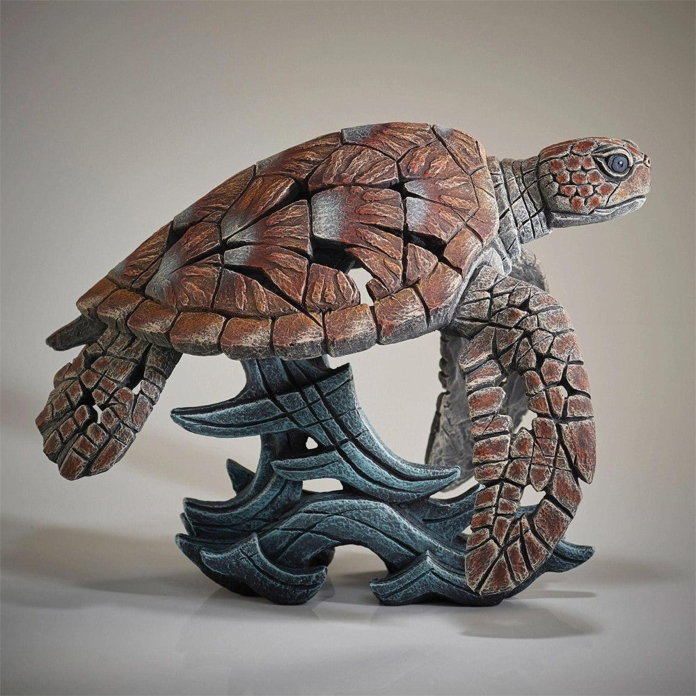 Intricate turtle sculpture with geometric patterns.