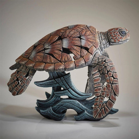 Intricate turtle sculpture with geometric patterns.