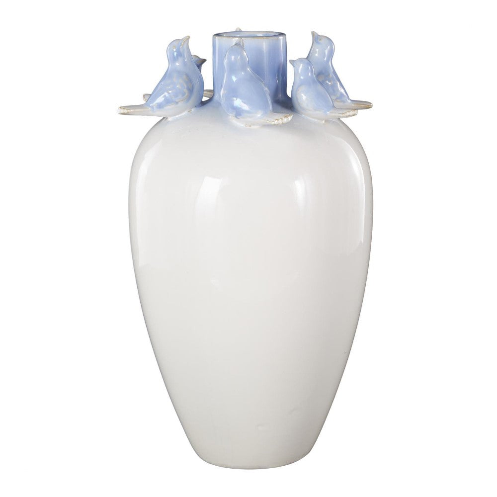 White vase with blue bird accents on the rim.