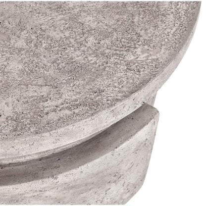 Close-up of textured round concrete surface, possibly a tabletop or decorative piece.