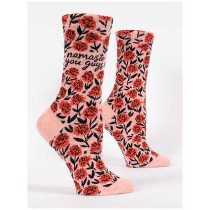 Floral socks with "namaste you guys" text.