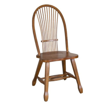 Wooden chair with a curved back and spindle design.