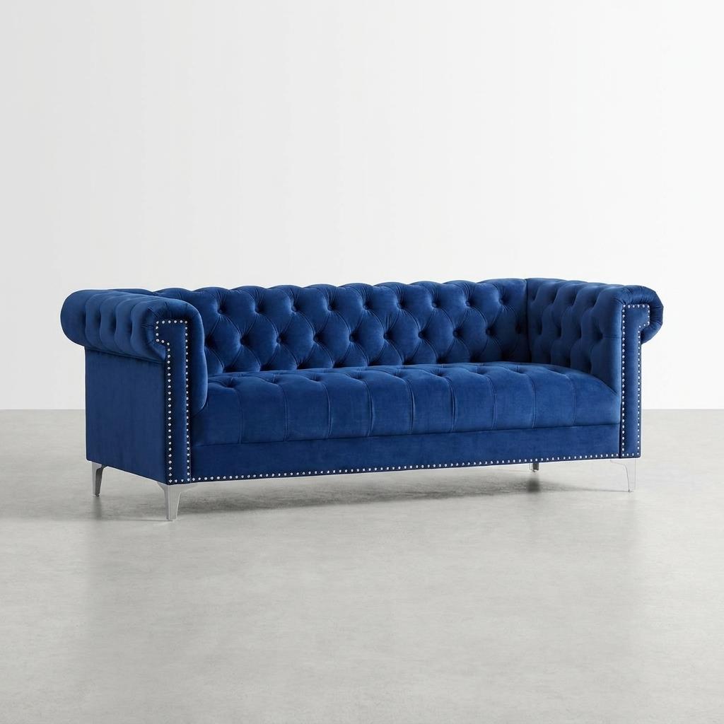 Luxurious blue velvet sofa with tufted cushions and studded accents.