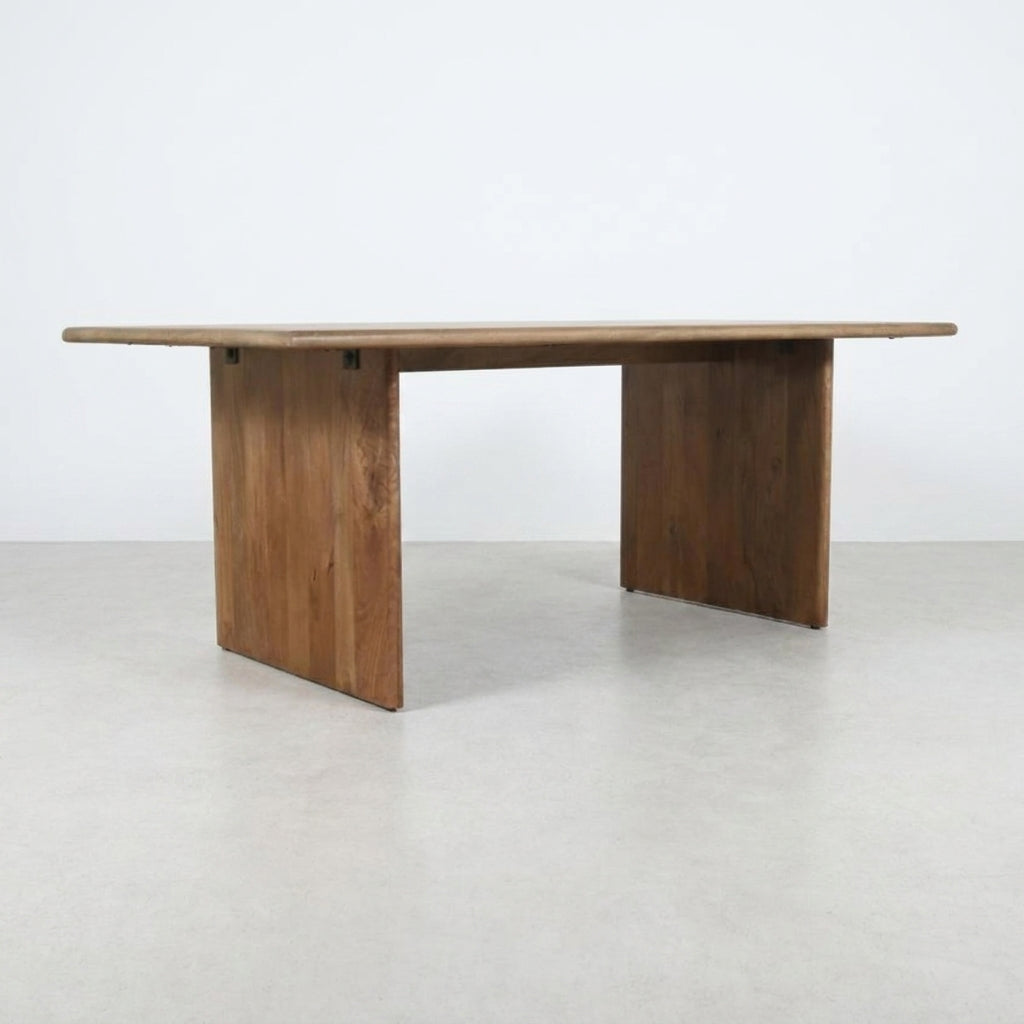 Simple wooden rectangular table with sturdy legs.