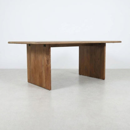 Simple wooden rectangular table with sturdy legs.