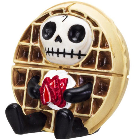 Skeleton waffle character holding whipped cream and strawberries.
