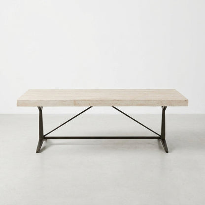 Minimalist table with a metal base and light wood top.