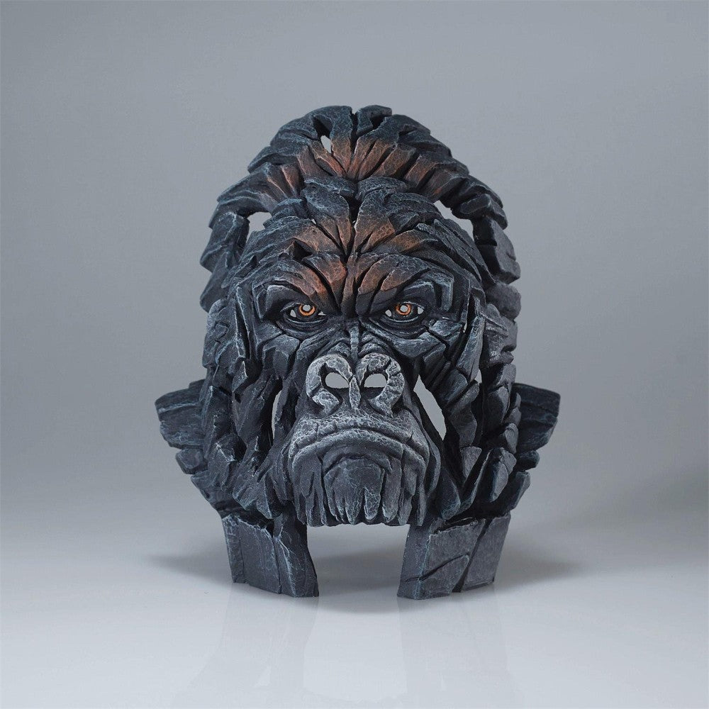 Sculpted gorilla face made of interconnected wooden pieces.