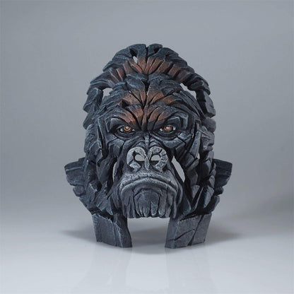 Sculpted gorilla face made of interconnected wooden pieces.