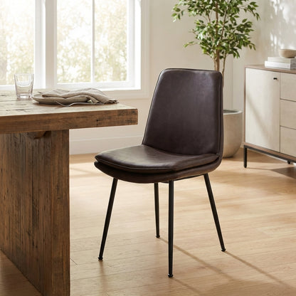 Brown leather chair with black metal legs.