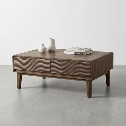 Wooden coffee table with wave-patterned front design.