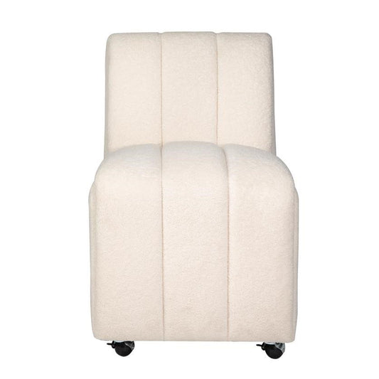 Creamy plush chair on wheels with vertical stitching.