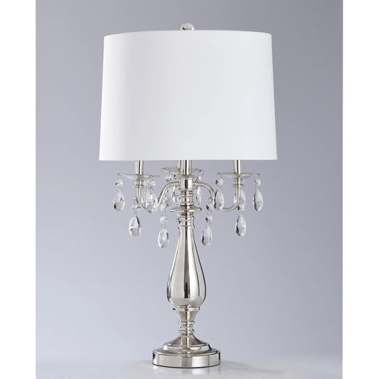 Elegant metal lamp with white shade and crystal accents.